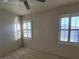 Bedroom featuring neutral carpet, plantation shutters, and a ceiling fan at 7728 Villa De La Paz Ave, Las Vegas, NV 89131