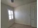 Bright bedroom with white trim and a window with plantation shutters at 7728 Villa De La Paz Ave, Las Vegas, NV 89131
