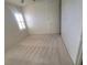 Bedroom featuring neutral walls, carpet, and a standard door at 7728 Villa De La Paz Ave, Las Vegas, NV 89131