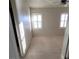 Bright bedroom with two windows and neutral carpet flooring providing a comfortable and inviting space at 7728 Villa De La Paz Ave, Las Vegas, NV 89131