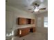 Bedroom with ceiling fan, plantation shutters and built in shelves at 7728 Villa De La Paz Ave, Las Vegas, NV 89131