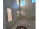 Foyer with high ceilings, decorative tile, and a front door with decorative glass at 7728 Villa De La Paz Ave, Las Vegas, NV 89131