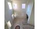 High ceiling foyer with circular staircase, chandelier, and decorative floor tile at 7728 Villa De La Paz Ave, Las Vegas, NV 89131