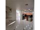 Open kitchen with stainless appliances, wood cabinets, and a center island with black countertop at 7728 Villa De La Paz Ave, Las Vegas, NV 89131
