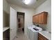 Functional laundry room with appliances, storage cabinets, and sink at 7728 Villa De La Paz Ave, Las Vegas, NV 89131