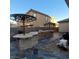 A custom outdoor kitchen and bar area offers a great space for entertaining in the private backyard at 7728 Villa De La Paz Ave, Las Vegas, NV 89131