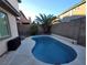 Enjoy this refreshing pool surrounded by lush landscaping, perfect for relaxing and entertaining at 7728 Villa De La Paz Ave, Las Vegas, NV 89131