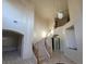 Curved staircase featuring decorative iron railing, marble steps and tiled floors at 7728 Villa De La Paz Ave, Las Vegas, NV 89131