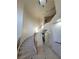 Bright foyer with a curved staircase and railing at 7728 Villa De La Paz Ave, Las Vegas, NV 89131