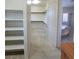 Spacious walk-in closet leading into a bathroom with a stand alone tub at 7728 Villa De La Paz Ave, Las Vegas, NV 89131