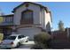 Charming two-story stucco home with a two car garage and tidy front yard at 780 Vortex Ave, Henderson, NV 89002