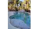 Swimming pool surrounded by mature trees, creating a backyard oasis for relaxation and recreation at 780 Vortex Ave, Henderson, NV 89002