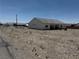 This well-maintained house features a desert landscape and a covered patio area at 790 Fort Churchill Rd, Pahrump, NV 89060