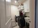 The laundry room features a modern washer and dryer, a utility sink, and practical shelving and storage at 790 Fort Churchill Rd, Pahrump, NV 89060