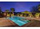 Inviting backyard pool with a lounge chair and pristine desert landscaping at 8 Reflection Cove Dr, Henderson, NV 89011