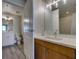 Bathroom boasts modern vanity with ample lighting and stylish fixtures at 8255 Las Vegas S Blvd # 1414, Las Vegas, NV 89123