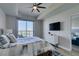 Cozy bedroom featuring a large sliding door with views of the city skyline at 8255 Las Vegas S Blvd # 1414, Las Vegas, NV 89123