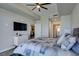 Bedroom with a ceiling fan, balcony access, and a modern dresser at 8255 Las Vegas S Blvd # 1414, Las Vegas, NV 89123