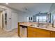 Gourmet kitchen with stainless steel dishwasher and spacious breakfast bar at 8255 Las Vegas S Blvd # 1414, Las Vegas, NV 89123