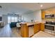Modern kitchen featuring stainless steel appliances, granite countertops, and an adjacent dining area at 8255 Las Vegas S Blvd # 1414, Las Vegas, NV 89123