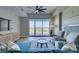 Bright living room featuring a sectional sofa, a stylish ceiling fan, and large windows with views at 8255 Las Vegas S Blvd # 1414, Las Vegas, NV 89123