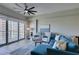 Stylish living room with a comfortable sectional, chairs, and a view of the city skyline at 8255 Las Vegas S Blvd # 1414, Las Vegas, NV 89123