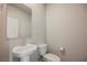 Bathroom with pedestal sink and commode at 8278 Palladium St, Las Vegas, NV 89113