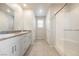Bathroom features a double vanity with granite countertops and a shower with a glass enclosure at 8278 Palladium St, Las Vegas, NV 89113
