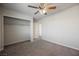 Spacious bedroom with neutral walls, carpet, and ceiling fan at 8278 Palladium St, Las Vegas, NV 89113