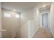 Upstairs hallway with carpet, windows, and access to a bedroom and bathroom at 8278 Palladium St, Las Vegas, NV 89113