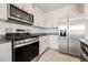 Stainless steel appliances, granite countertops, and light cabinetry in this modern kitchen at 8278 Palladium St, Las Vegas, NV 89113