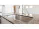 Close up of the kitchen island sink with granite countertop and faucet at 8278 Palladium St, Las Vegas, NV 89113