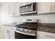 Modern stainless steel gas range and overhead microwave at 8278 Palladium St, Las Vegas, NV 89113
