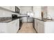 Close up of kitchen featuring modern appliances, granite countertops, and tile floors at 8278 Palladium St, Las Vegas, NV 89113