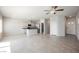 Open-concept living room featuring an island kitchen, and bright natural light at 8278 Palladium St, Las Vegas, NV 89113