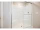 Bathroom shower with subway tile surround, glass door, and built-in seat, providing a comfortable experience at 8278 Palladium St, Las Vegas, NV 89113