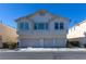 Charming two-story townhouse with three-car garage and desert landscaping at 8843 Tomnitz Ave # 102, Las Vegas, NV 89178