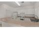 Functional kitchen features white cabinetry and essential appliances at 8843 Tomnitz Ave # 102, Las Vegas, NV 89178