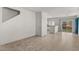 Open concept living room with tile flooring and ample natural light at 8843 Tomnitz Ave # 102, Las Vegas, NV 89178