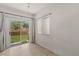 Bright living room with tile floors and sliding door access to the backyard at 8843 Tomnitz Ave # 102, Las Vegas, NV 89178