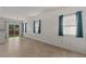 Bright living room with tile floors, sliding door access to the backyard at 8843 Tomnitz Ave # 102, Las Vegas, NV 89178