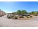 Community walking path features decorative landscaping, sidewalks, and nearby homes at 8843 Tomnitz Ave # 102, Las Vegas, NV 89178