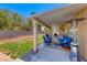 Relaxing backyard patio area with comfortable seating and a well-maintained lawn at 8914 Termoli St, Las Vegas, NV 89123