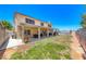 Large backyard features a covered patio, green grass, and ample space for outdoor activities at 8914 Termoli St, Las Vegas, NV 89123