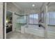 Bathroom with glass shower and bathtub at 8914 Termoli St, Las Vegas, NV 89123