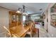 Inviting dining area with open access to the living room and featuring a wooden table with seating for six at 8914 Termoli St, Las Vegas, NV 89123