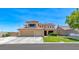Charming two-story home featuring a tile roof, a spacious three-car garage, and manicured landscaping at 8914 Termoli St, Las Vegas, NV 89123
