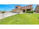 Inviting home with a well-maintained front lawn and a three-car garage offering suburban curb appeal at 8914 Termoli St, Las Vegas, NV 89123