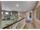 Hallway with carpet and white banister and brown railing at 8914 Termoli St, Las Vegas, NV 89123