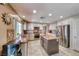 Spacious kitchen features stainless steel appliances, granite countertops, and a central island, perfect for cooking at 8914 Termoli St, Las Vegas, NV 89123
